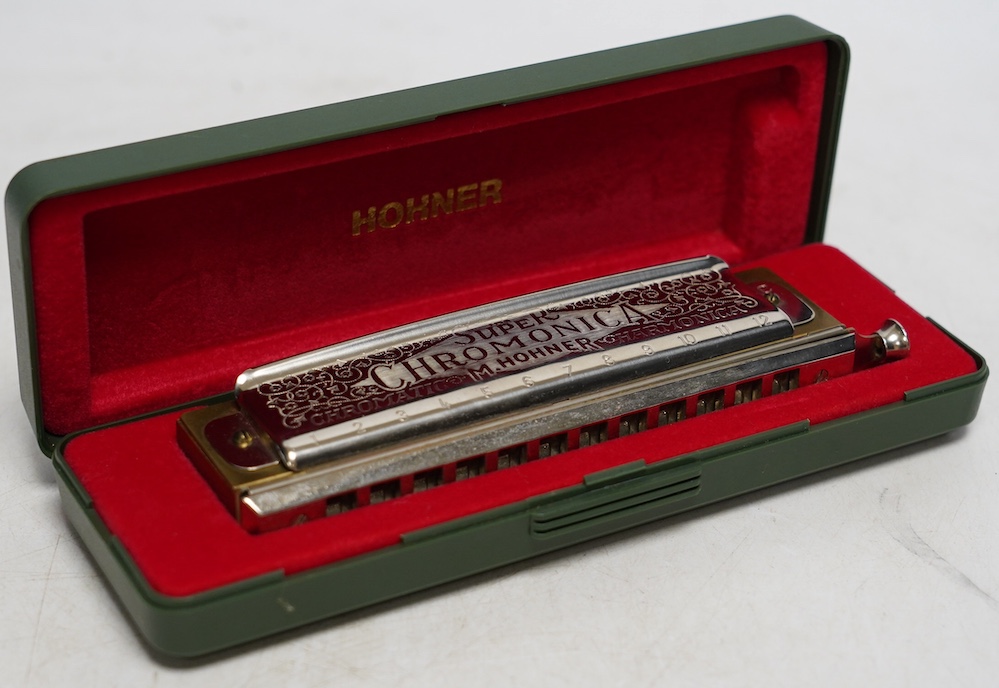 A cased Hohner Super Chromonica 270. Condition - good